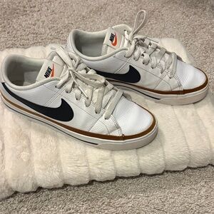 Nike Women’s White Leather Sneakers with Black Swoosh and Brown Trim